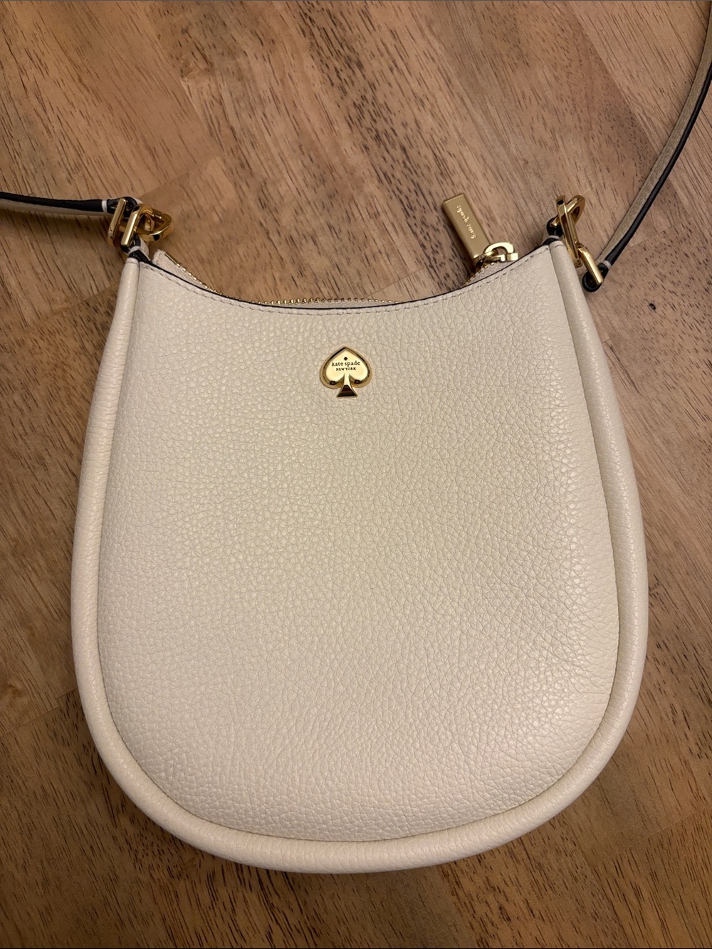 kate spade Cream Pebbled Leather Crescent Crossbody with Gold Accent